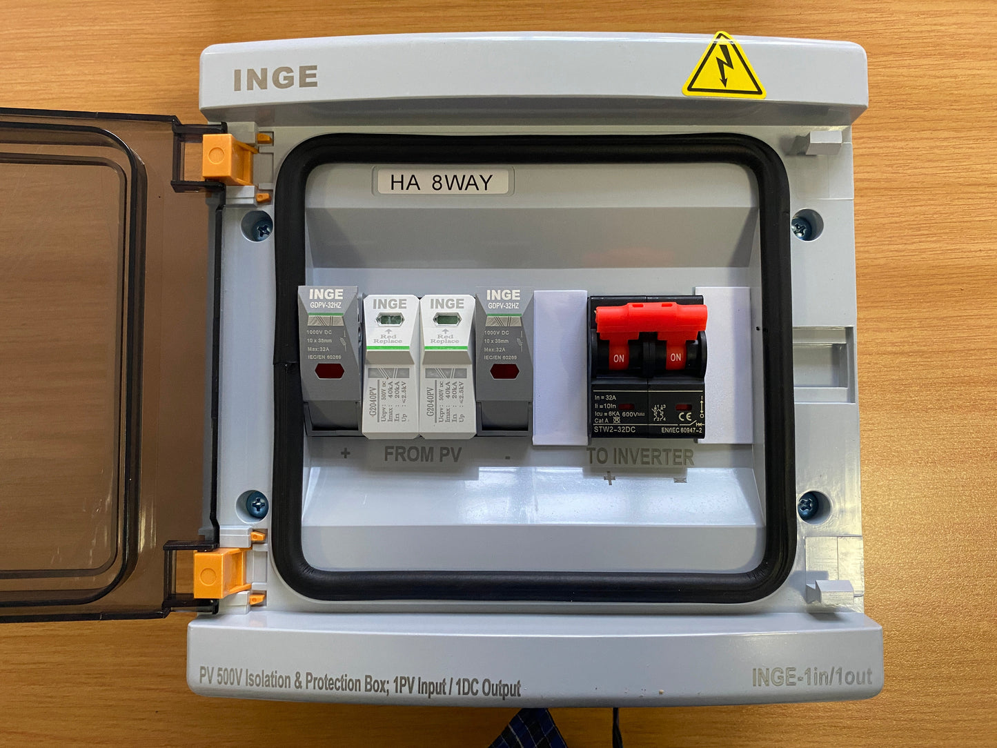 INGE electrical panel with various components on a wooden surface