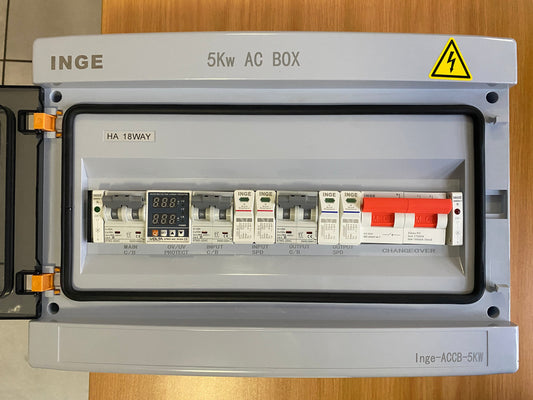 INGE 5Kw AC Box with electrical components on a wooden surface