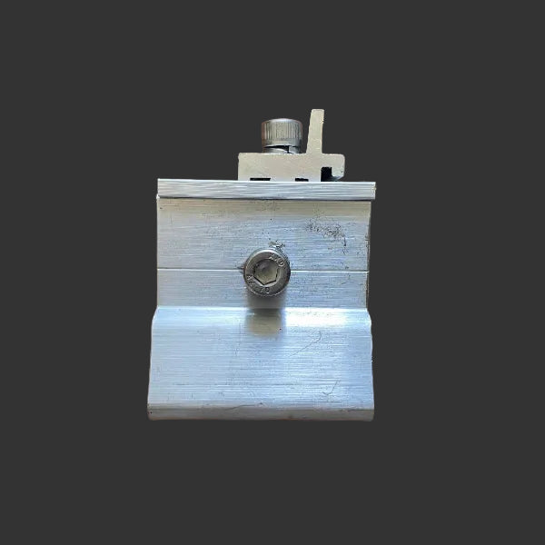 Metal tool with a hex nut on a wooden surface