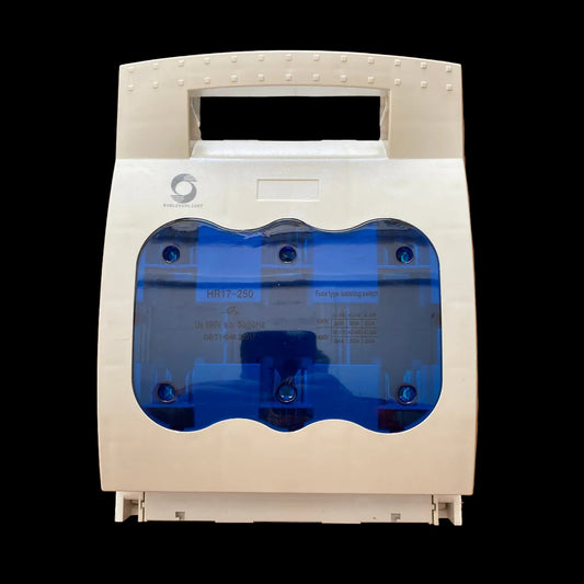A white plastic water filter housing with a translucent blue window, photographed from above on a wooden surface.